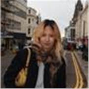 Patient and supportive English tutor helping non-native speakers build strong language skills