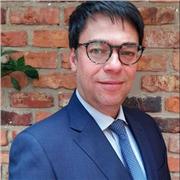 Economist teaches introductory Micro and Macroeconomics