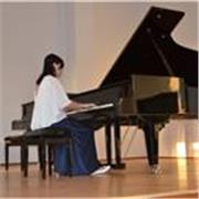 Dedicated piano tutor providing structured yet enjoyable lessons for children and adults of any level