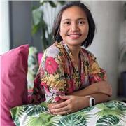 Yoga teacher providing energising yoga to able-bodied people including those who are pregnant