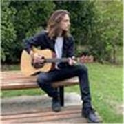 I can help you learn guitar! i can teach you chords and songs you love, i can also teach you how to read and write TAB