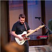 Experienced professional musician available for guitar lessons, specialising in acoustic guitar