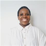 A dedicated TEFL teacher helping adult learners communicate clearly and confidently