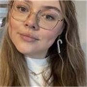 Bubbly teacher, determined to help with language studies.
