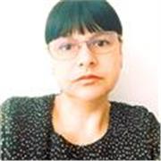 An English teacher conducts English lessons to teens and adults