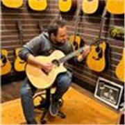 Private guitar teacher offering beginner lessons for adults and teenagers