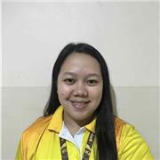 Supportive teacher creating simple lessons for beginner learners.