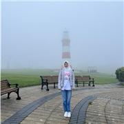 Supportive science tutor guiding GCSE students to success