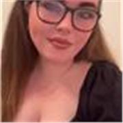 Friendly English teacher helping students communicate confidently