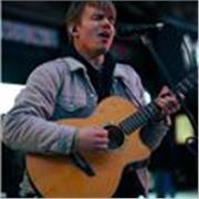 Guitar tutor for beginners and intermediates offering friendly in-person and online lessons in London.