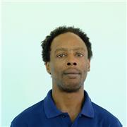 Patient, supportive teacher helping learners build confidence and fluency.