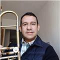 Profesor de música, con énfasis en instrumentos de viento metal (tuba, trompeta, barítono, trombón), solfeo, iniciación musical