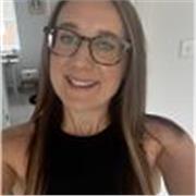 A female leader in the third sector with coaching skills and a masters degree education. 