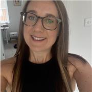 A female leader in the third sector with coaching skills and a masters degree education.