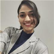 Friendly teacher helping students improve speaking, reading, writing, and grammar through simple student-friendly lessons