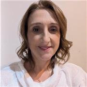 Calm, skilled tutor supporting EAL children’s English development.