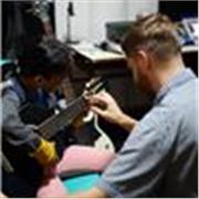 Full-time professional music teacher giving guitar and music theory classes catered to individual interests and needs