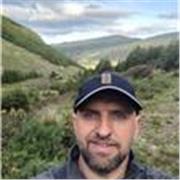 I have a Native level of English, and can help improve your grammar