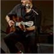Multilingual English teacher combining language learning through music.