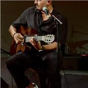 Multilingual English teacher combining language learning through music.