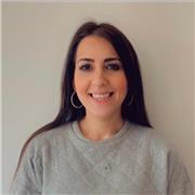 Multilingual English teacher helping young adults gain confidence