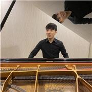Music teacher providing piano lesson for beginners