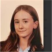 GCSE English literature student aiming for grade 9s holding friendly and patient primary school tutoring.