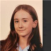 GCSE English literature student aiming for grade 9s holding friendly and patient primary school tutoring.