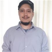 A (7.0 in the IELTS test/IELTS certified) computer science teacher who teaches programming in english for all children/adults.