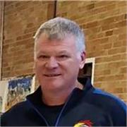 Friendly, patient tutor helping adults improve English fluency.