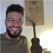 start with simple chords (like G, C, D), practice scales for finger dexterity, and learn to read tabs for easy note reference