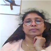 Friendly maths teacher guiding learners to understand concepts clearly.