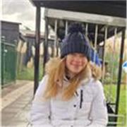 Patient student tutor helping primary and KS3 students 


