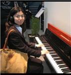 piano tutor providing lessons to younger children