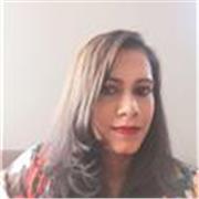 Warm, professional tutor teaching English basics to business. 