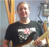 Guitar tutor providing online guitar and music theory lessons