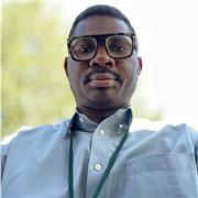 A professional who can teach GCSE Biology effectively.