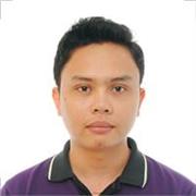 Guitar tutor who teaches basic chords to children of all ages