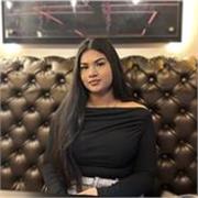 Fluent English tutor helping foreign learners communicate confidently.